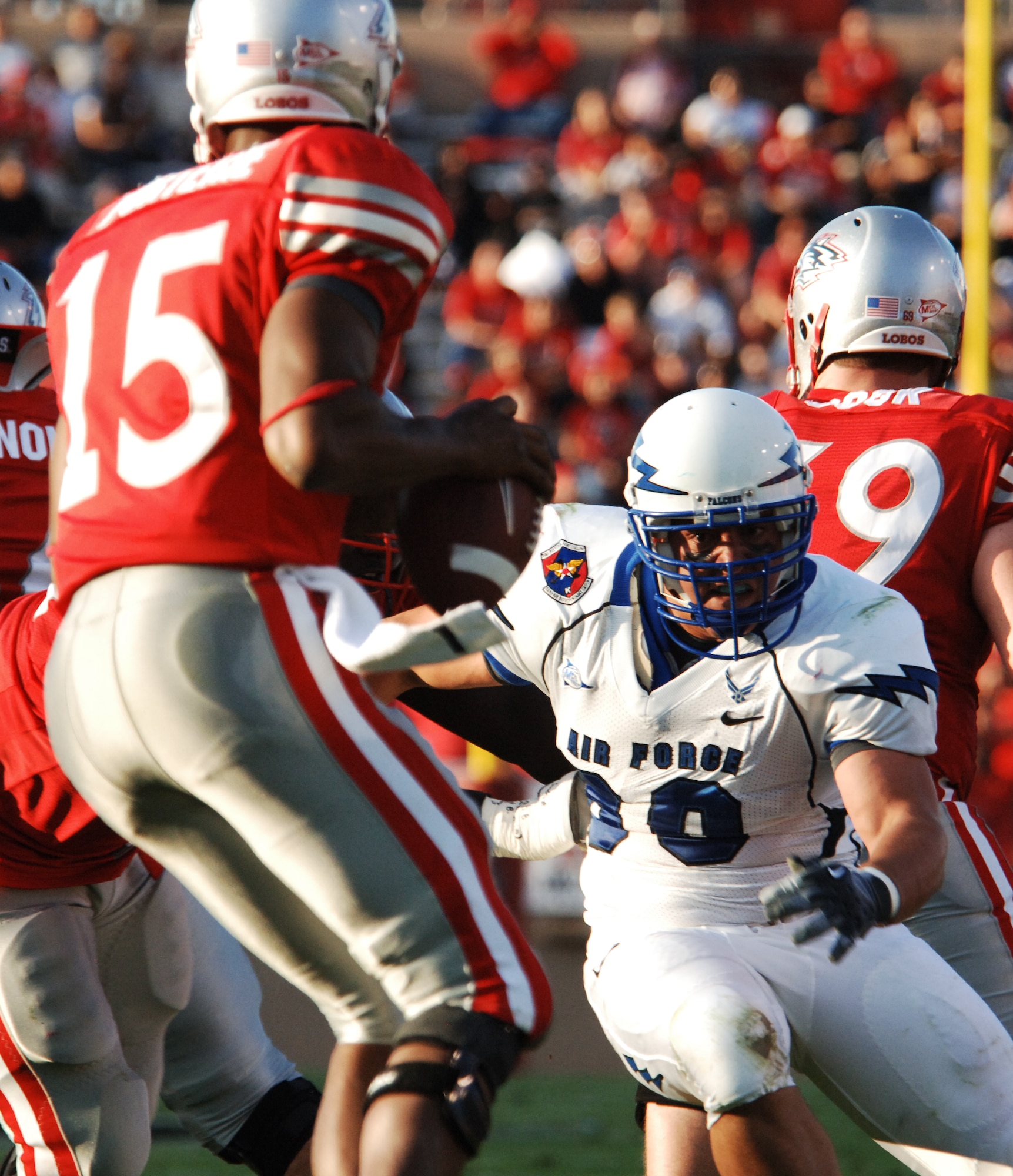 Falcons defensive end Ryan Ricketts pressures Lobos quarterback Donovan Porterie during the Air Force-New Mexico game at University Stadium in Albuquerque, N.M., Sept. 19, 2009. Ricketts, a junior from San Jose, Calif., had three tackles in Air Force's 37-13 victory. Porterie was 4-8 with one interception. (U.S. Air Force photo/John Van Winkle)