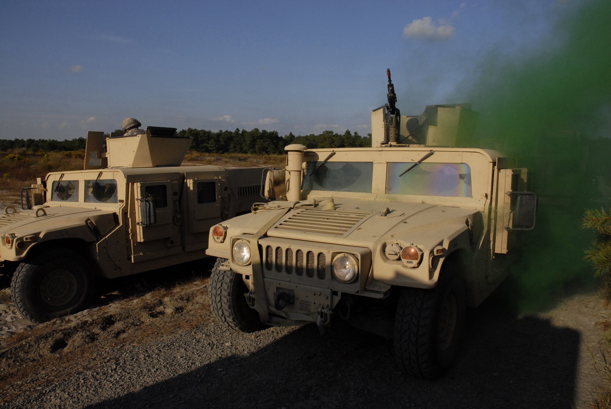 Security forces Airmen protect a vehicle that was disabled by a simulated explosion of an improvised explosive device during a pre-deployment training exercise conducted by the U.S. Air Force Expeditionary Center's 421st Combat Training Squadron at Joint Base McGuire-Dix-Lakehurst, N.J. on September 15, 2009.  (U.S. Air Force photo/Tech. Sgt. Paul R. Evans)