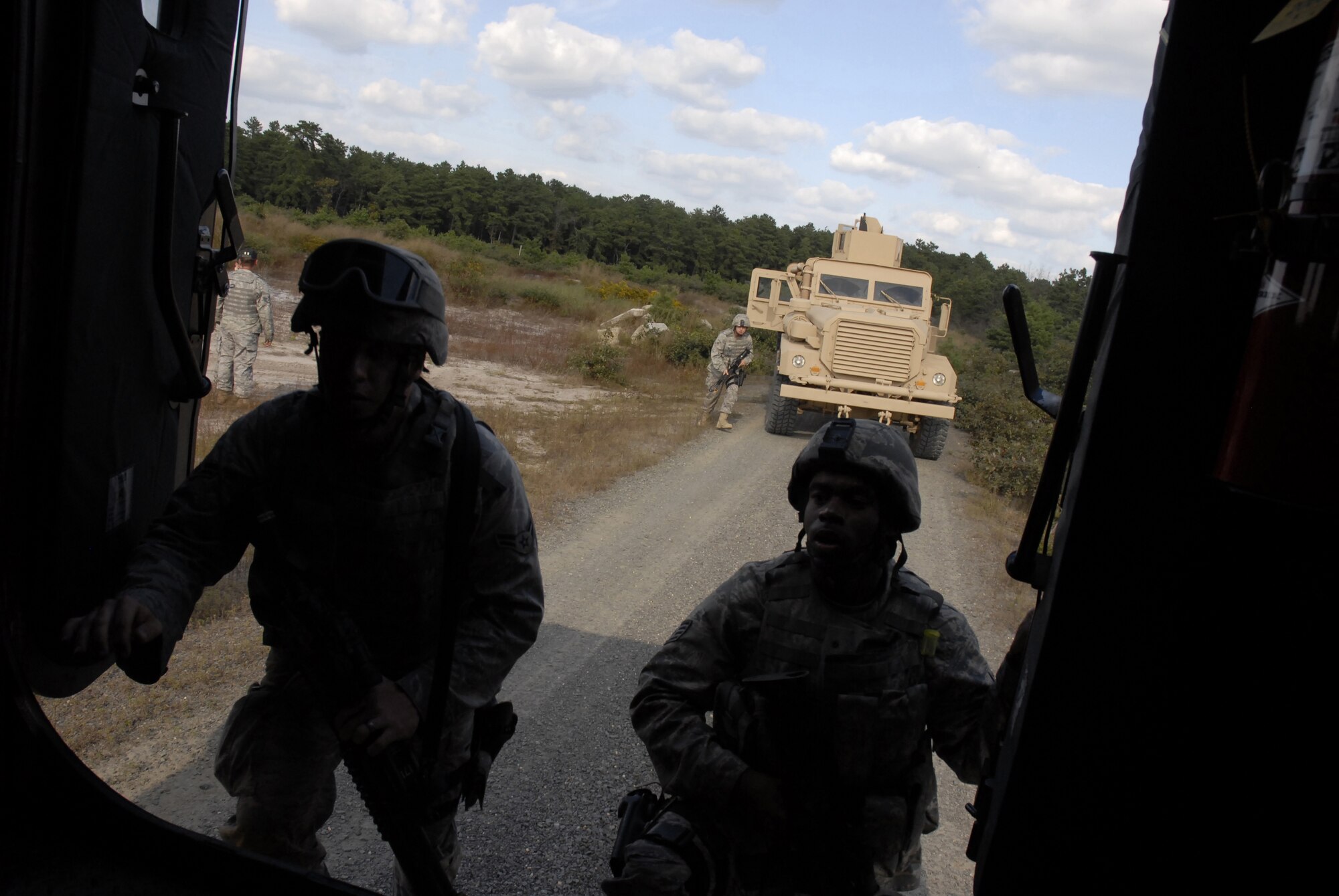 Security forces Airmen respond to a simulated explosion of an improvised explosive device that disabled a vehicle in their convoy during a pre-deployment training exercise conducted by the U.S. Air Force Expeditionary Center's 421st Combat Training Squadron at Joint Base McGuire-Dix-Lakehurst, N.J. on September 15, 2009.  (U.S. Air Force photo/Tech. Sgt. Paul R. Evans)