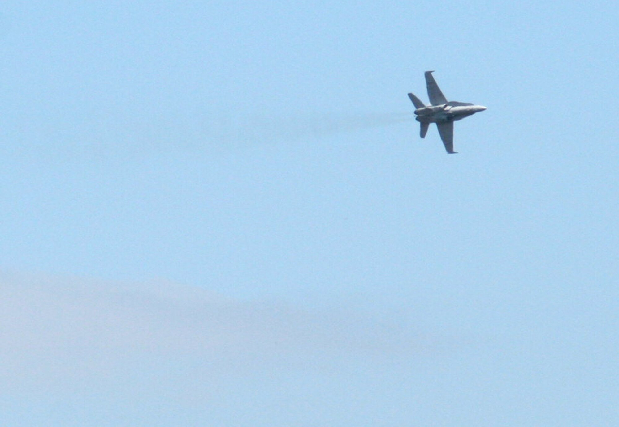 A U.S. Navy F-18 Hornet flies during a practice run for the 2009 Scott Air Force Base Airshow on Sept. 18, 2009, at Scott AFB, Ill.  The airshow took place from Sept. 19 and 20 drawing tens of thousands of people.  (U.S. Air Force Photo/Tech. Sgt. Scott T. Sturkol) 