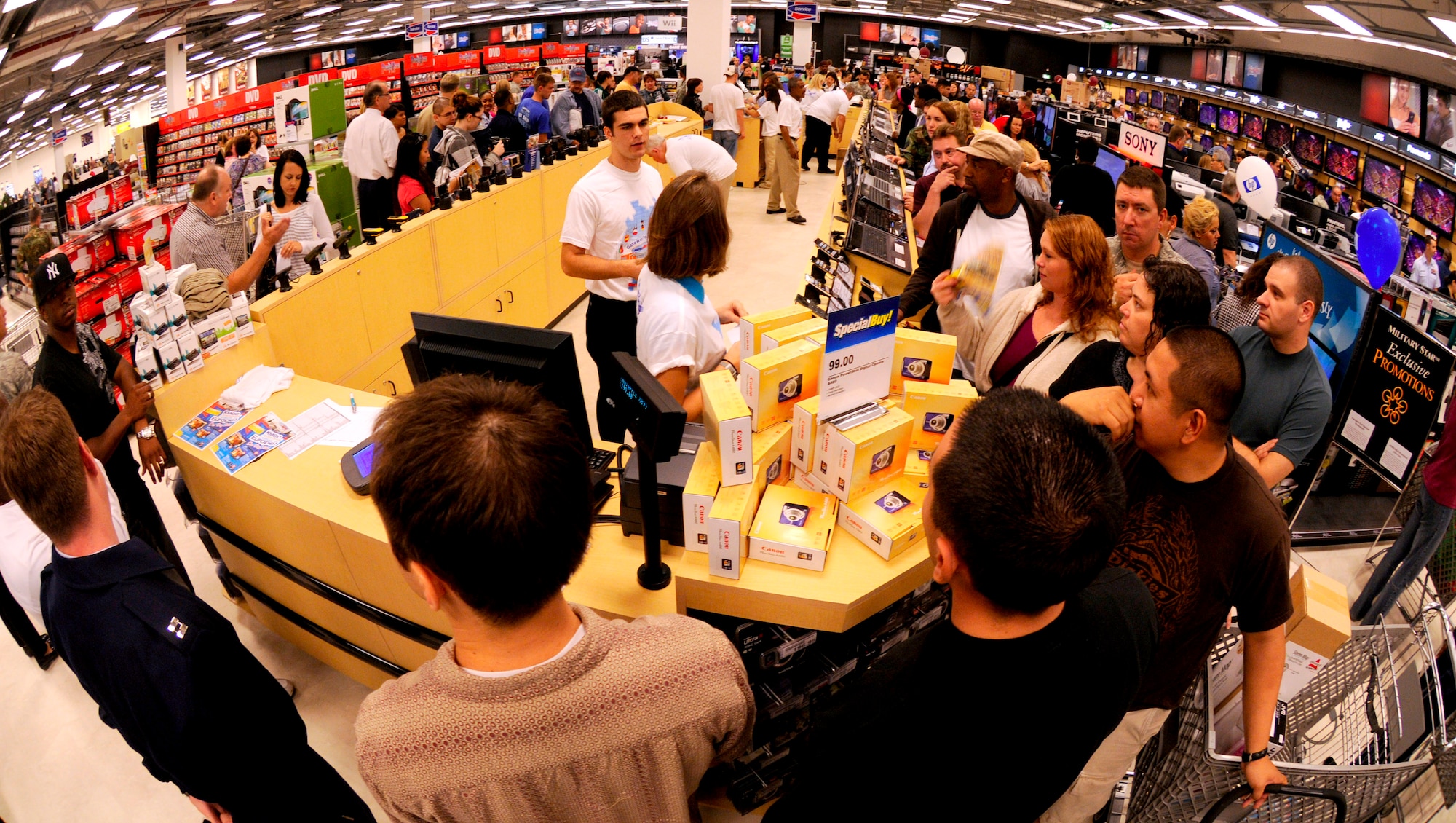 Kaiserslautern Military Community members line up in the power zone section of the Kaiserslautern Military Community Center to purchase electronic appliances during the KMCC grand opening, Ramstein, Germany, Sept. 21, 2009. The third and final phase of the KMCC opened with a ribbon cutting ceremony that formally began operations at the largest Base Exchange in the world. (U.S. Air Force photo by Tech. Sgt. Kenneth Bellard)