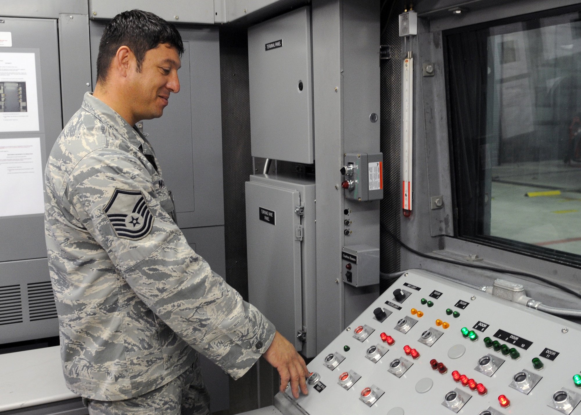 SPANGDAHLEM AIR BASE, Germany -- Master Sgt. Christopher Montoya, 52nd Component Maintenance Squadron, checks out the new Program Logic Control system in Hush House three Sept. 21. One of the things the PLC controls is the amount of air intake allowed in the building during an engine run and can be customized depending on how much air a specific engine needs.  The Air Force is standardizing all Hush Houses and all of them will be receiving the PLC system.  (U.S. Air Force photo/Airman 1st Class Nathanael Callon)