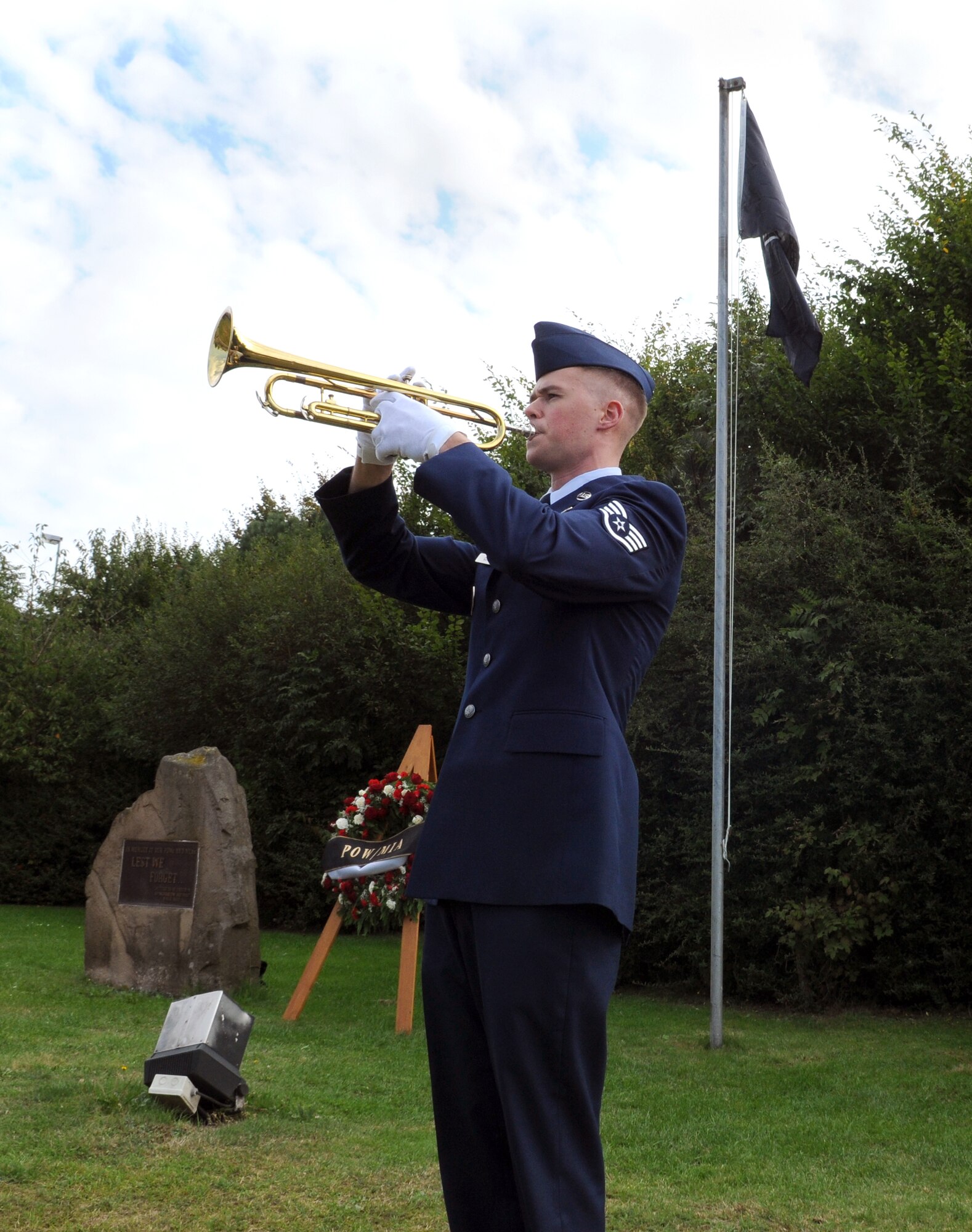SPANGDAHLEM AIR BASE, Germany -- Staff. Sgt. Nicholas Cooley, 52nd Force Support Squadron, plays taps during the POW/MIA ceremony at the Air Park Sept. 18. Taps is played during flag ceremonies and funerals to honor fallen U.S. servicemembers. (U.S. Air Force photo/Airman 1st Class Nathanael Callon)