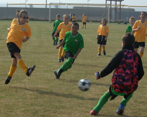SPANGDAHLEM AIR BASE, Germany – Saber Madison Westfall, daughter of Tech. Sgt. Robert Westfall, 52nd Civil Engineer Squadron, takes a shot at the goal during a 9-and 10-year-old youth soccer game here Sept. 19. The youth soccer league focuses on teaching fundamentals, positions and teamwork. The Gators defeated the Sabers 5-0 and now stand at 2-0 for the season. (U.S. Air Force photo/Airman 1st Class Staci Miller)