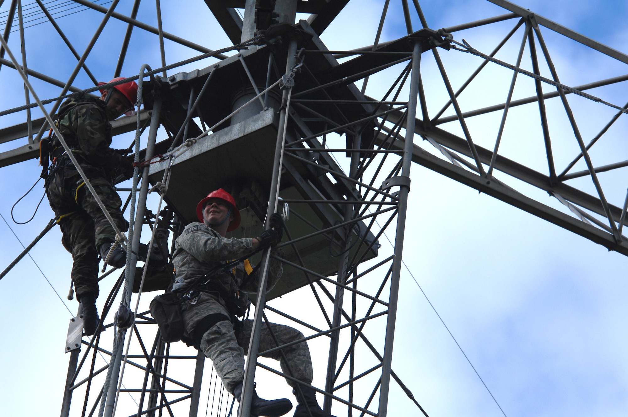 U.S. Air Force Tech. Sgt. Tim Daniel and Staff Sgt. Sean Lavely, 1st Communications Maintenance Squadron, perform annual preventative maintenance inspections on an antenna systems at Royal Air Force Base, Barford in England. They are deployed from Kapaun Air Station, Germany, as part of the Cable and Antenna Theater Maintenance Team who travel routinely throughout Europe maintaining the communications capability force across the Atlantic and on into the European Route. (U.S. Air Force photo by Tech. Sgt. Michael Voss)