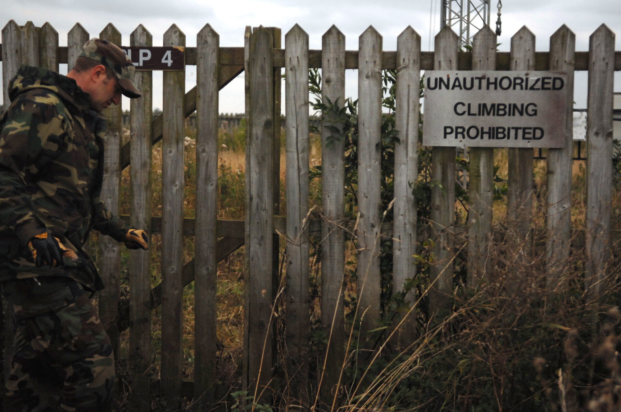 U.S. Air Force Staff Sgt. Sean Lavely, 1st Communications Maintenance Squadron, enters in the controlled area to perform annual preventative maintenance inspections on an antenna systems at Royal Air Force Base, Barford in England. Sergeant Lavely is deployed from Kapaun Air Station, Germany, as part of the Cable and Antenna Theater Maintenance Team who travel routinely throughout Europe maintaining the communications capability force across the Atlantic and on into the European Route. (U.S. Air Force photo by Tech. Sgt. Michael Voss)