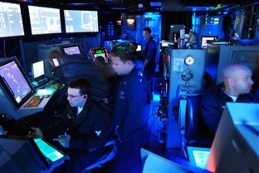 U.S. sailors work at their watch stations in the carrier-controlled approach center aboard the aircraft carrier USS John C. Stennis in the Pacific Ocean, Sept. 19, 2009. Stennis is under way conducting fleet replacement squadron carrier qualifications off the coast of Southern California.