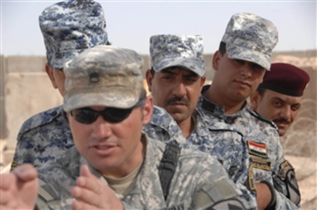 U.S. Army Staff Sgt. Jonathan Esposito with Bravo Troop, 1st Battalion, 7th Cavalry Regiment, out of Fort Hood, Texas, teaches Iraqi Military Police how to move in a stack at Joint Security Station Istiqlaal, in Baghdad, Iraq, on Sept. 14, 2009.  