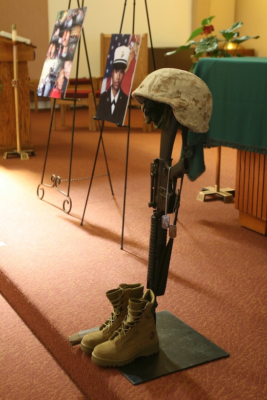 A helmet rests on a rifle for Cpl. Marleea Ann Gerfen, a Marine Aviation Logistics Squadron 16 Marine who died in a motorcycle accident Sept. 13. The memorial was held at the Airman Memorial Chapel here Sept. 21. Cpl. Gerfen enlisted in the Marine Corps in 2005.
