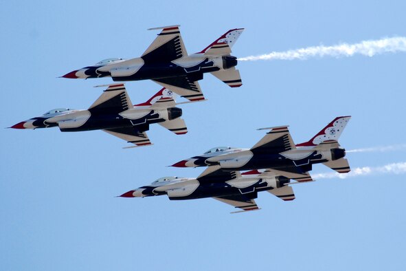 HICKAM AIR FORCE BASE, Hawaii -- The Thunderbirds, U.S. Air Force Demonstration Squadron, perform over Hickam Air Force Base, Hawaii, during the "Wings Over the Pacific," Open House Sept. 19 before a crowd of more than 42,000. The Thunderbirds demonstrate the capabilities the F-16 Fighting Falcon by performing combat maneuvers during their aerial demonstration. This is Hickam's first open house since 2003, and a crowd of nearly 100,000 paid a visit during the weekend. (U.S. Air Force photo/Staff Sgt. Mike Meares)
