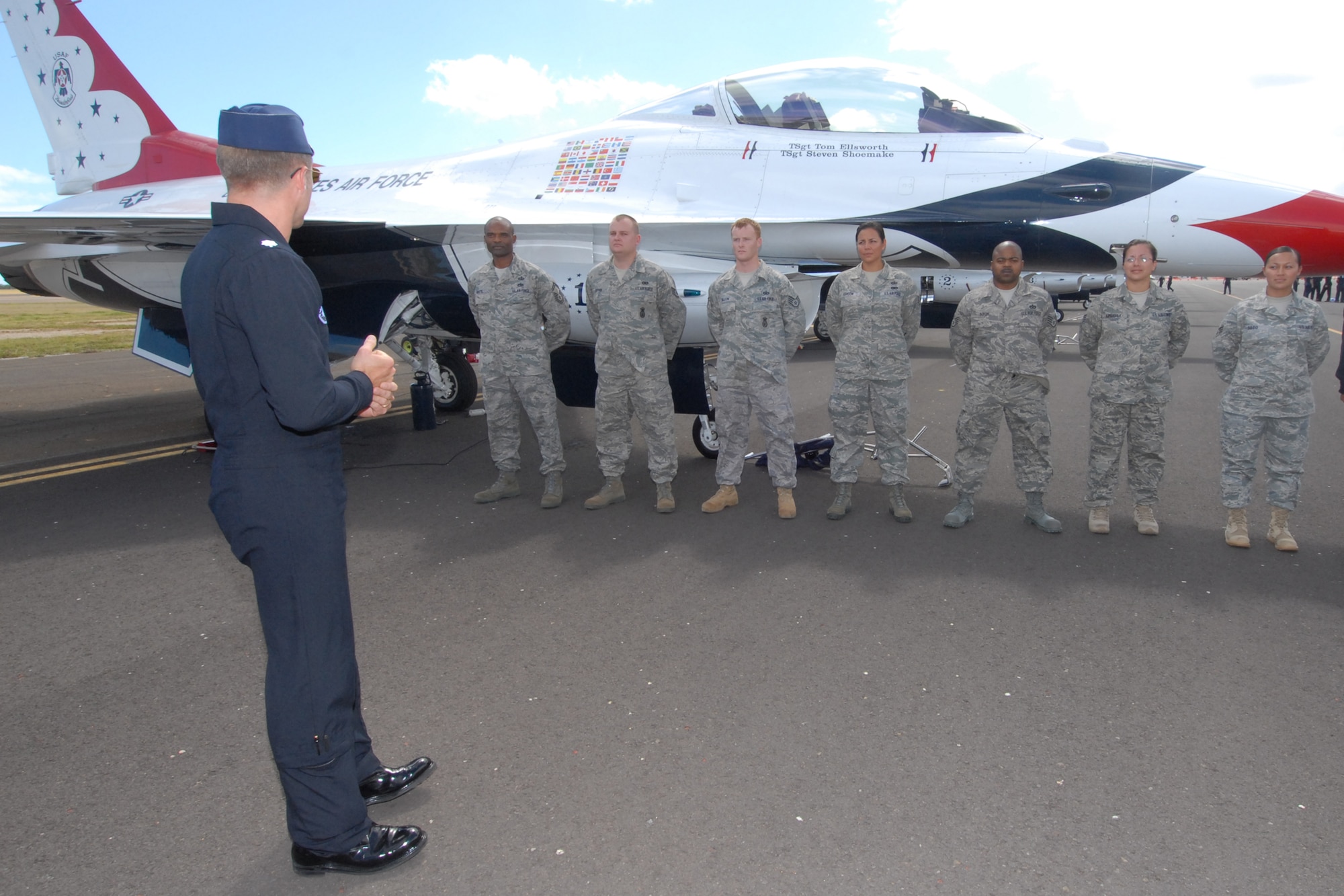 HICKAM AIR FORCE BASE, Hawaii -- Lt. Col. Greg Thomas, U.S. Air Force Thunderbird #1 Commander, speaks to friends and family of Airmen preparing to reenlist into the Air Force Sept. 18 prior to the Thunderbirds taking to the skies. The Airmen who reenlisted were: Senior Master Sgt. Orville White, Staff Sgt. Travis Dixon, Staff Sgt. Ehtan Ervin, Staff Sgt. Casey Hanson, Staff Sgt. Mary Kimberly, Staff Sgt. Charles Nelson and Senior Airman Elyana Soto. They reenlisted on the Air Force's 62nd birthday. (U.S. Air Force photo/Staff Sgt. Mike Meares)