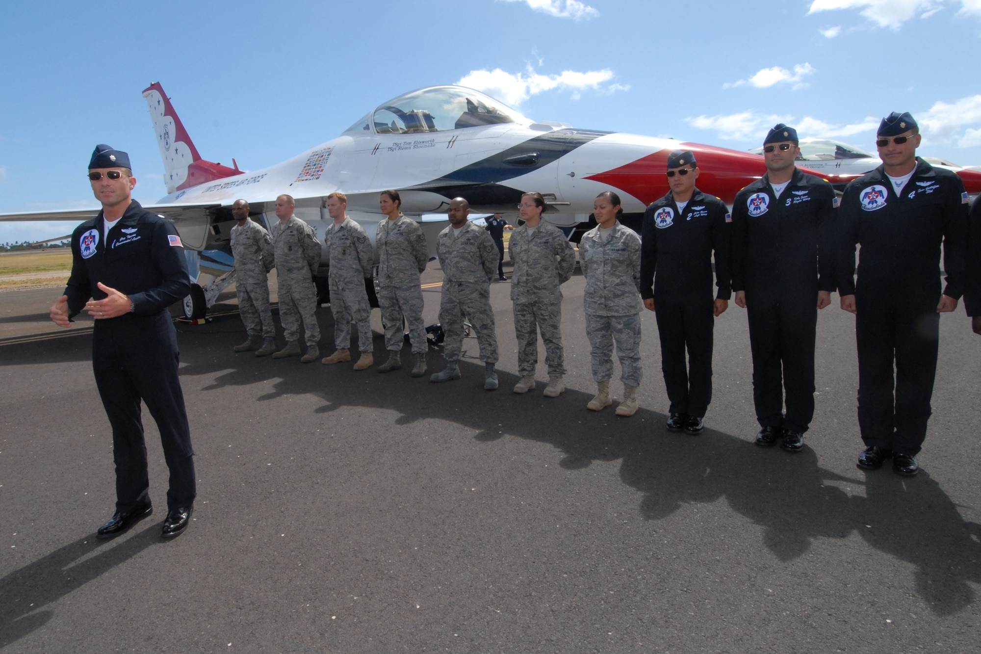 HICKAM AIR FORCE BASE, Hawaii -- Lt. Col. Greg Thomas, U.S. Air Force Thunderbird #1 Commander, speaks to friends and family of Airmen preparing to reenlist into the Air Force Sept. 18 prior to the Thunderbirds taking to the skies. The Airmen who reenlisted were: Senior Master Sgt. Orville White, Staff Sgt. Travis Dixon, Staff Sgt. Ehtan Ervin, Staff Sgt. Casey Hanson, Staff Sgt. Mary Kimberly, Staff Sgt. Charles Nelson and Senior Airman Elyana Soto. They reenlisted on the Air Force's 62nd birthday. (U.S. Air Force photo/Staff Sgt. Mike Meares)