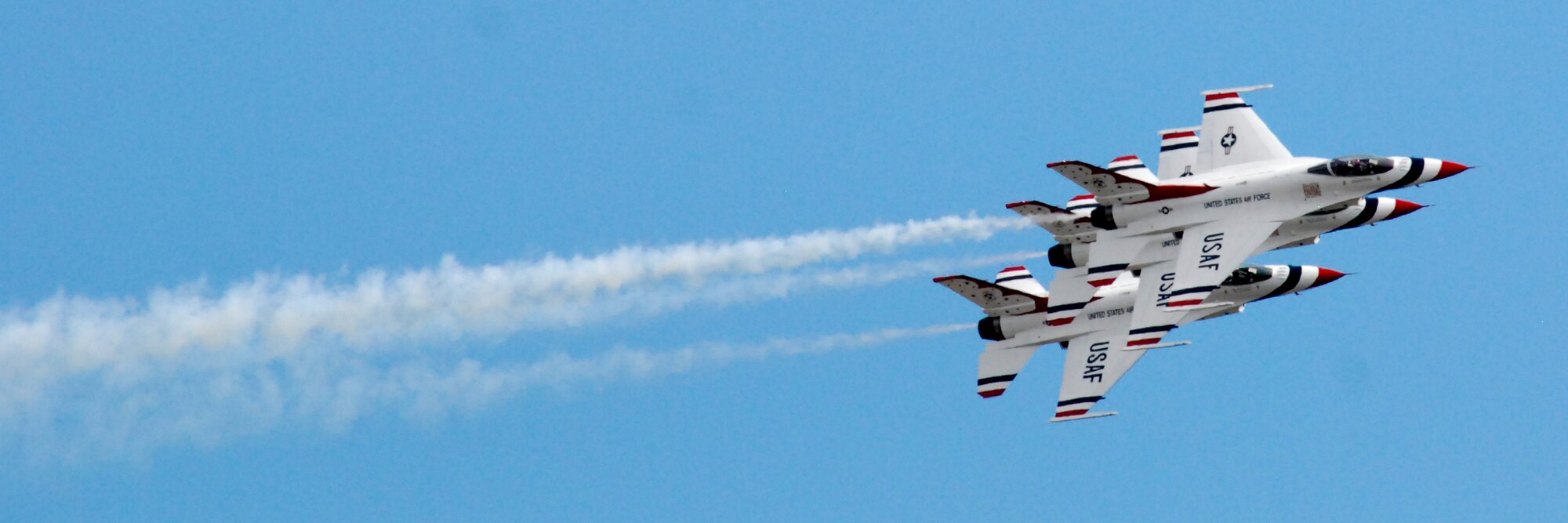HICKAM AIR FORCE BASE, Hawaii -- The Thunderbirds, U.S. Air Force Demonstration Squadron, practice their performance over Hickam Air Force Base for the "Wings Over the Pacific," Open House Sept. 18. The Thunderbirds demonstrate the capabilities the F-16 Fighting Falcon by performing combat maneuvers during their aerial demonstration. This is Hickam's first open house since 2003, and a crowd of nearly 100,000 paid a visit during the weekend. (U.S. Air Force photo/Staff Sgt. Mike Meares)