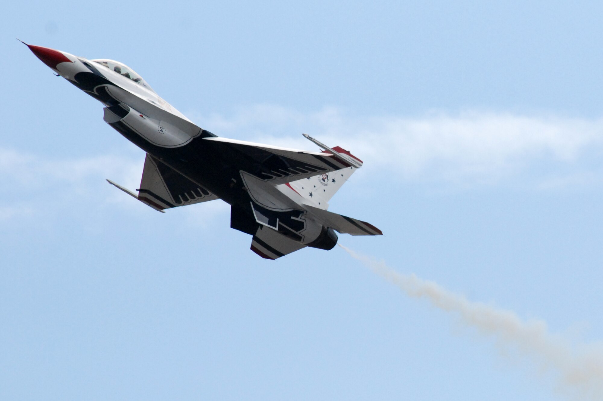 HICKAM AIR FORCE BASE, Hawaii -- The Thunderbirds, U.S. Air Force Demonstration Squadron, practice their performance over Hickam Air Force Base for the "Wings Over the Pacific," Open House Sept. 18. The Thunderbirds demonstrate the capabilities the F-16 Fighting Falcon by performing combat maneuvers during their aerial demonstration. This is Hickam's first open house since 2003, and a crowd of nearly 100,000 paid a visit during the weekend. (U.S. Air Force photo/Staff Sgt. Mike Meares)