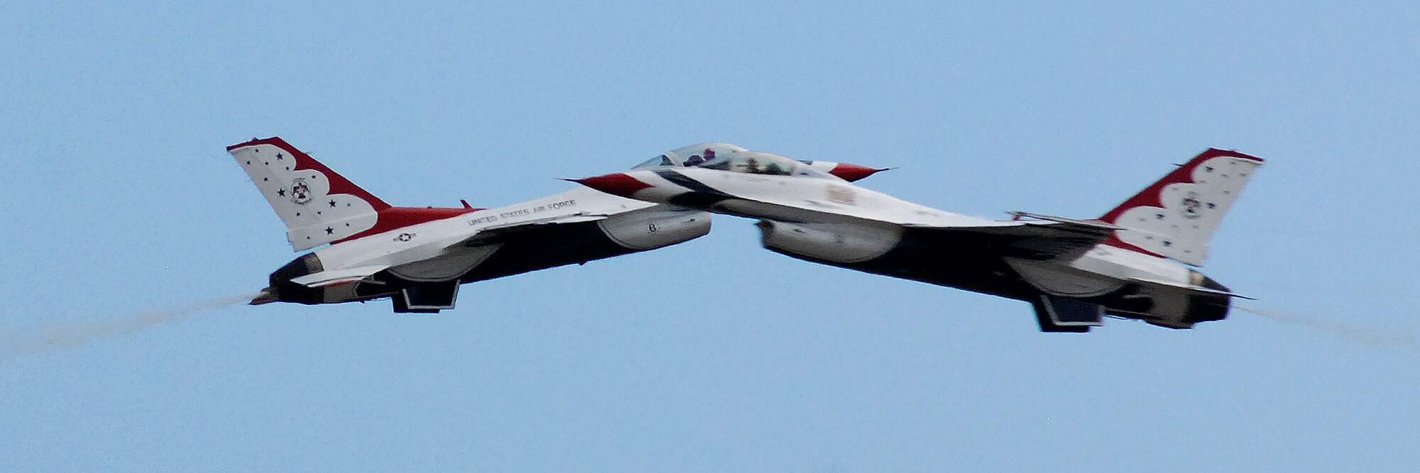 HICKAM AIR FORCE BASE, Hawaii -- The Thunderbirds, U.S. Air Force Demonstration Squadron, practice their performance over Hickam Air Force Base for the "Wings Over the Pacific," Open House Sept. 18. The Thunderbirds demonstrate the capabilities the F-16 Fighting Falcon by performing combat maneuvers during their aerial demonstration. This is Hickam's first open house since 2003, and a crowd of nearly 100,000 paid a visit during the weekend. (U.S. Air Force photo/Staff Sgt. Mike Meares)