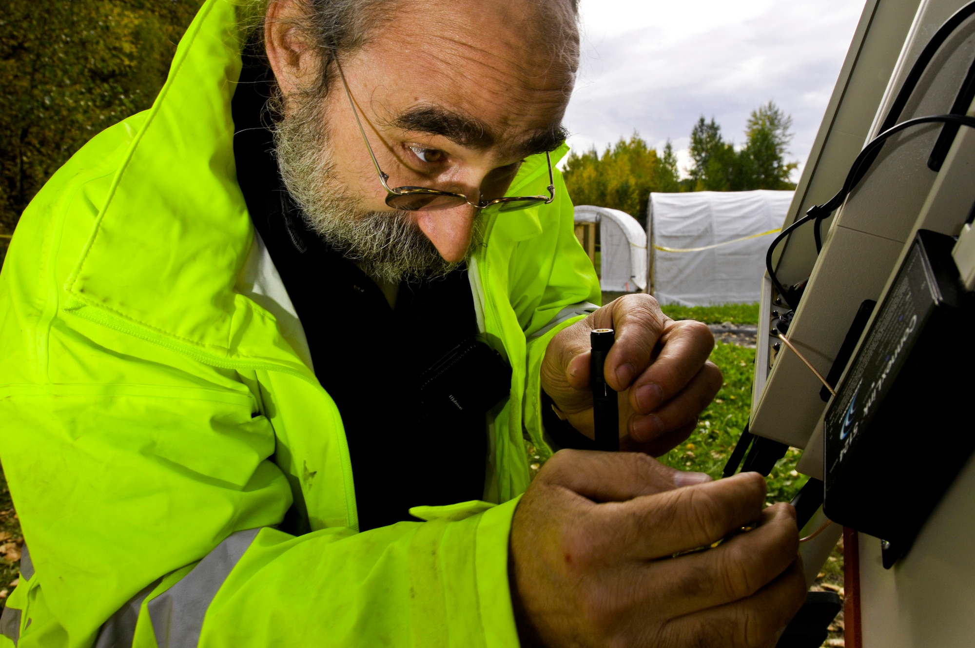 ELMENDORF AIR FORCE BASE, Alaska – John Rose, 611th Civil Engineer Squadron, fixes a weather vane Sept. 17. The weather vane helped 611th CES members know which direction and how fast the wind was blowing. This helped predict where the hazardous waste would spread on the water during their annual Fall Spill Drill held Sept. 14-18. The 611th CES members are required to do hands-on training twice a year, one in the winter and practiced on thick ice and the second in the fall before the ice freezes over. (U.S. Air Force photo/Airman 1st Class Christopher Gross)