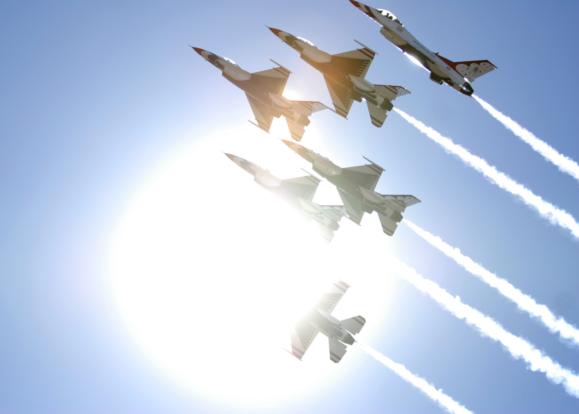 HICKAM AIR FORCE BASE, Hawaii -- The Thunderbirds, U.S. Air Force Demonstration Squadron, arrive in typical style over Hickam Air Force Base, Hawaii, during their initial arrival for "Wings Over the Pacific," Sept. 16. The Thunderbirds will demonstrate the capabilities the F-16 Fighting Falcon by performing combat maneuvers during their aerial portion of the weekend event Sept. 19-20. This is Hickam's first open house since 2003, and a crowd of more than 120,000 are expected to visit during the weekend. (U.S. Air Force photo/Senior Airman Gustavo Gonzalez)