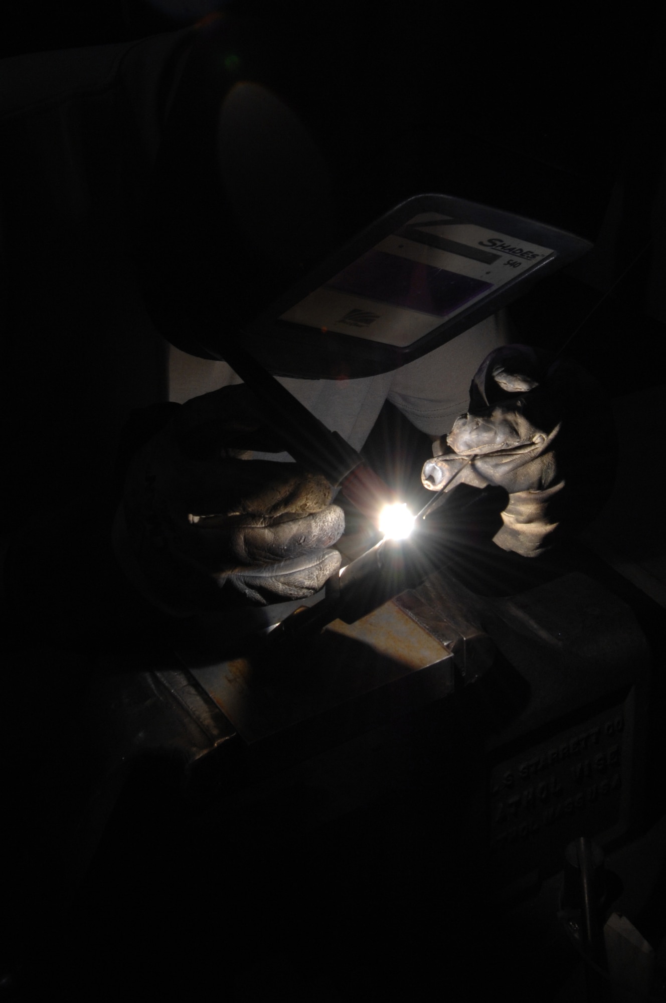 WHITEMAN AIR FORCE BASE, Mo. – Staff Sgt. John Reading , Aircraft Metals Technician, 131st Maintenance Squadron, welds an aluminum pipe here today .  Metal technicians are qualified to, but not limited to, perform metals machining, welding and designing machine precision tools or other equipment used to support the mission. (U.S. Air Force photo/Senior Airman Jessica Snow) 