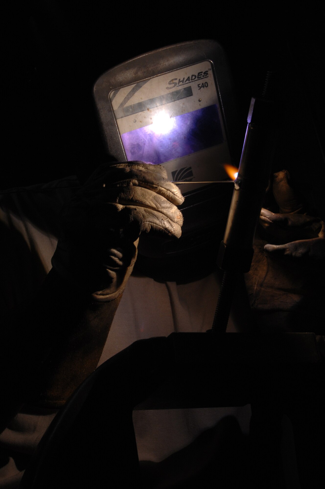 WHITEMAN AIR FORCE BASE, Mo. – Staff Sgt. John Reading , Aircraft Metals Technician, 131st Maintenance Squadron, welds an aluminum pipe here today .  Metal technicians are qualified to, but not limited to, perform metals machining, welding and designing machine precision tools or other equipment used to support the mission. (U.S. Air Force photo/Senior Airman Jessica Snow) 
