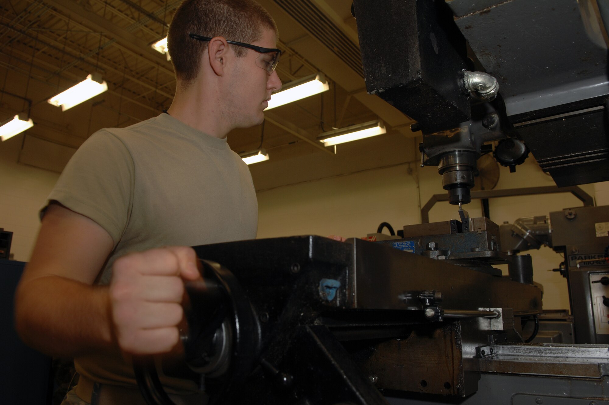 WHITEMAN AIR FORCE BASE, Mo. – Airman 1st Class Craig Scott, Aircraft Metals Technician, 509th Maintenance Squadron, modifies a metal scrapper here today.  Metal technicians are qualified to, but not limited to, perform metals machining, welding and designing machine precision tools or other equipment used to support the mission. (U.S. Air Force photo/Senior Airman Jessica Snow) 