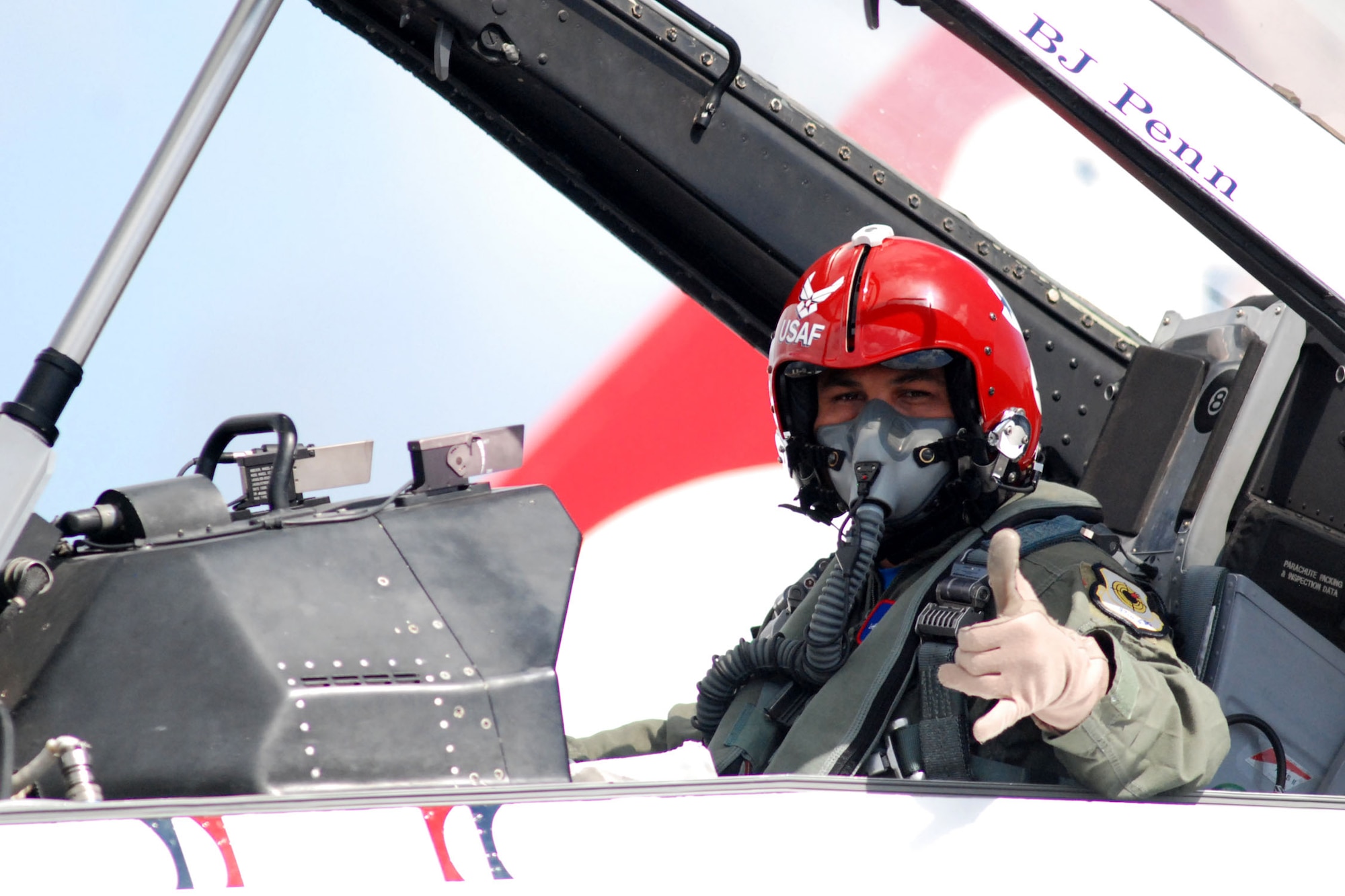 HICKAM AIR FORCE BASE, Hawaii -- B.J. Penn, Ultimate Fighter Championship Lightweight Champion, waves the shaka before taking off in an F-16 Fighting Falcon with the Thunderbirds, U.S. Air Force Air Demonstration Squadron, for an orientation flight here, Sep. 18. During the flight, they performed ariel combat maneuvers pulling more than nine G's at one point. (U.S. Air Force photo/Staff Sgt. Mike Meares)