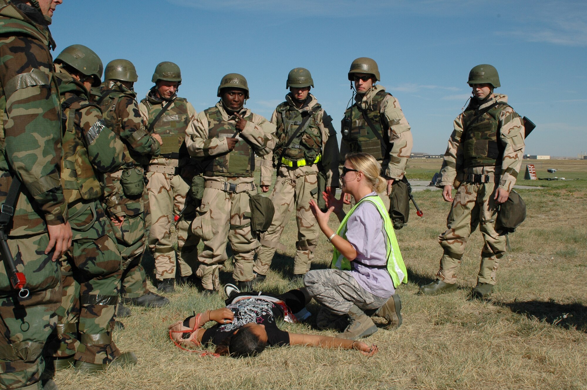 Tech. Sgt. Sarah Edwards, 341st Medical Operations Squadron medical technician, gives feedback to Airmen after treating simulated injuries during a Self Aid and Buddy Care exercise Sept. 17 at Camp Grizzly. (U.S. Air Force photo/Senior Airman Dillon White)