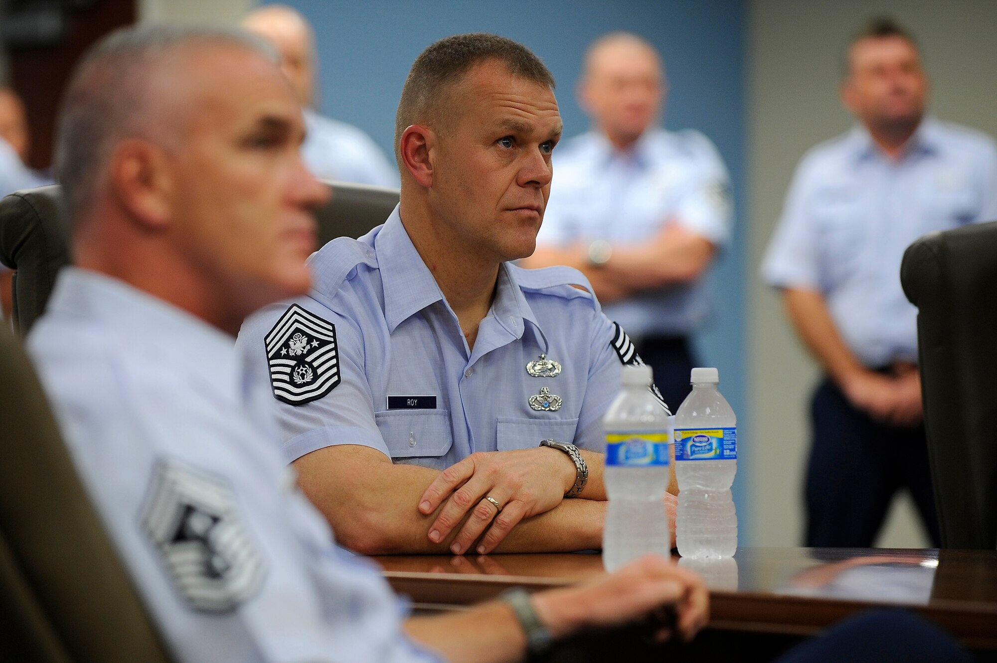 U.S. Air Force Chief Master Sgt. Brooke McLean, 1st Special Operations Wing Command Chief and Chief Master Sergeant of the Air Force James A. Roy listen to a presentation Sept. 21, 2009, at Hurlburt Field, Fla. (U.S. Air Force photo by Senior Airman Jason Epley/Released)