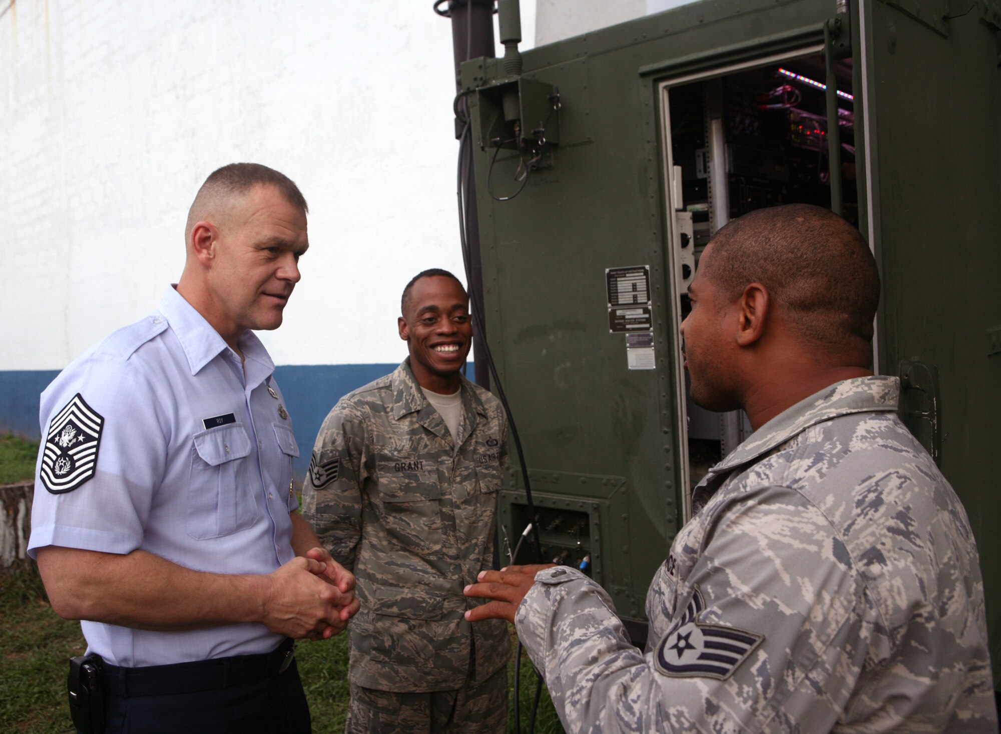 Chief Master Sgt. of the Air Force James A. Roy speaks to Staff Sgt. Leighton Grant (center) and Staff Sgt. Rodney Hawkins during a visit with Airmen of the 612th Air Expeditionary Communications Squadron deployed at Capt.Juan Delgado Air Base during Fuerzas Aliadas PANAMAX 2009 Sept. 19, 2009, in Panama City, Panama. The exercise is a multinational exercise with 20 participating countries tailored to the defense of the Panama Canal, involving more than 4,500 personnel from the U. S. Southern Command area of focus. (U.S. Navy photo/Petty Officer 1st Class David P. Coleman) 