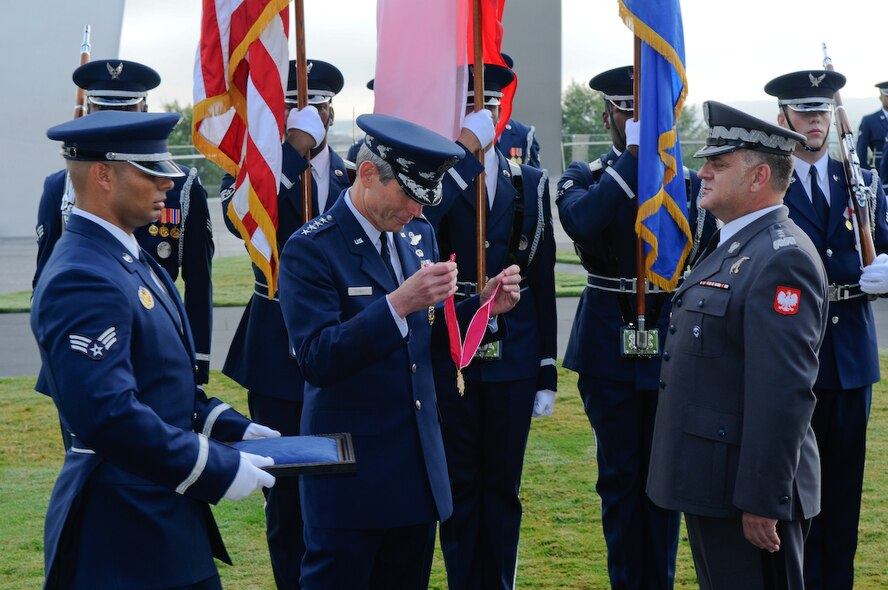 Gen. Norton A. Schwartz, Air Force chief of staff, presents the Legion of Merit to Lt. Gen. Andrzej Blasik, commander of the Polish air force, at the U.S Air Force Memorial Sept. 22. This is the first United States decoration created specifically to award citizens of other nations.  The decoration was established in 1940 by an Act of Congress. (U.S. Air Force photo by Senior Airman Alexandre Montes)
