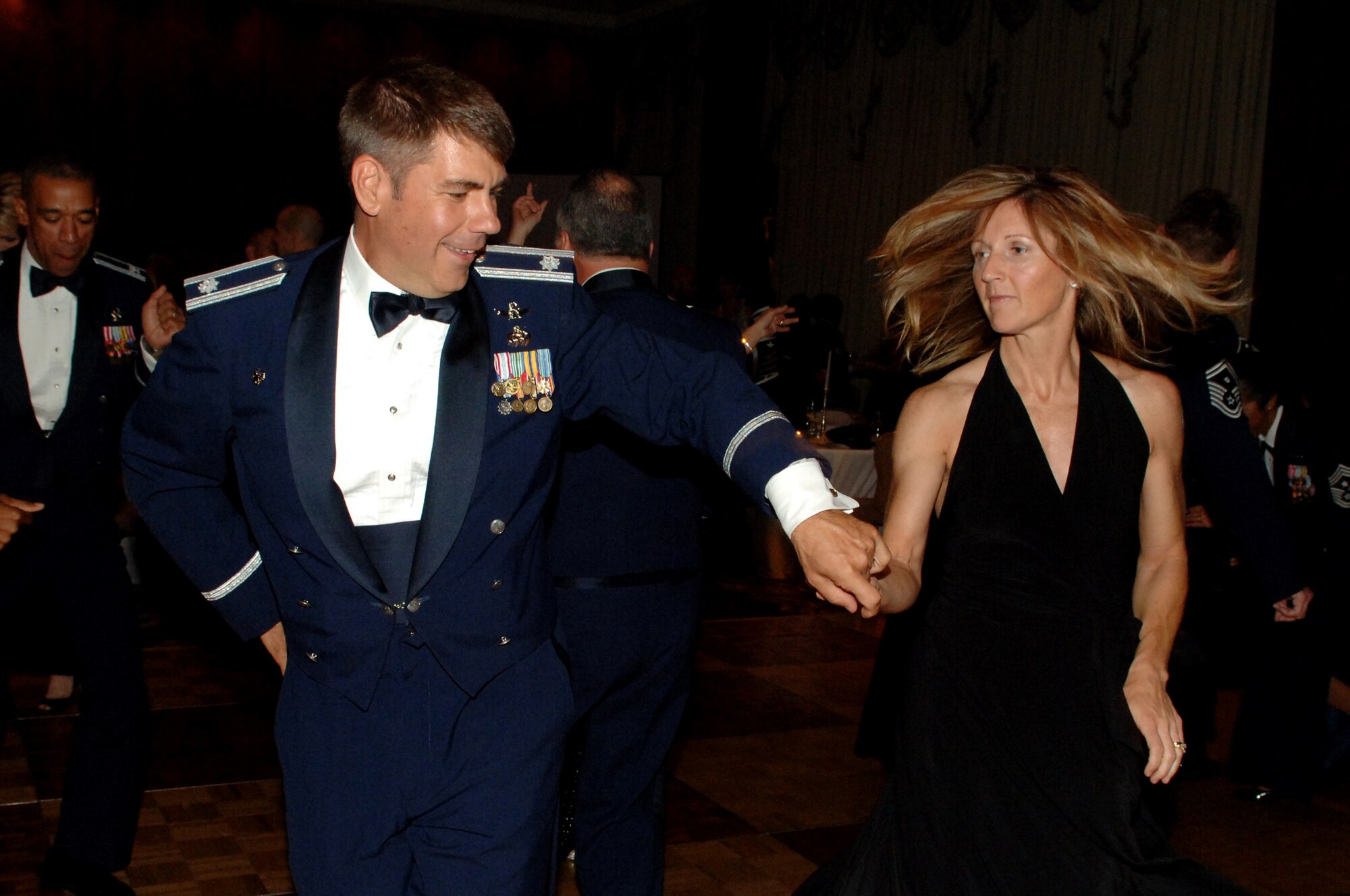 Lt. Col Delbert Jones, II, 460th Communications Squadron, and his wife, Bethany dance at the Air Force Ball. The ball was in celebration of the 62nd anniversary of the U.S. Air Force. (U.S. Air Force photo by Tech. Sgt. J. LaVoie)