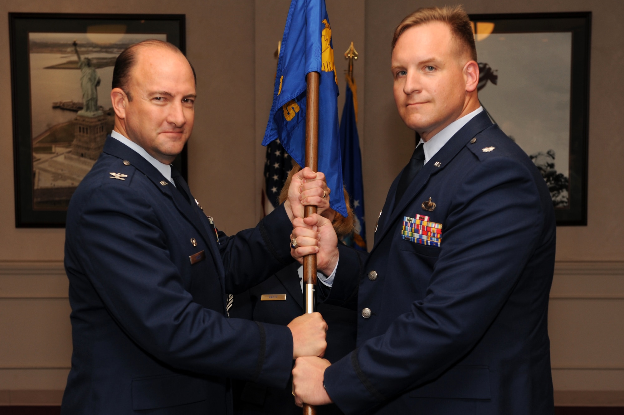 Col. George Risse, 19th Mission Support Group commander, passes the 19th Contracting Squadron guidon to Lt. Col. Matthew Sinning, new 19th Contracting Squadron commander, during the 19th Contracting Squadron assumption-of-command ceremony Sept. 16. Colonel Sinning last served as the Chief, Strategic Sourcing Branch, Contracting Division for Headquarters Air Force Space Command.
(US Air Force photo by Senior Airman Jim Araos)
