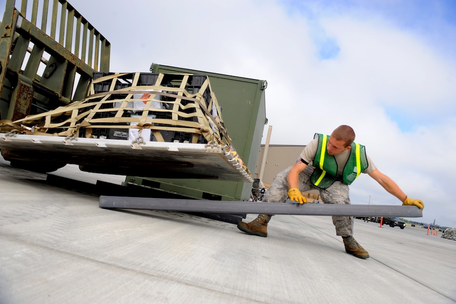 MOODY AIR FORCE BASE, Ga. -- Senior Airman Erik Maziarz, 23rd Logistic Readiness Squadron marshal augmentee, prepares for a cargo pallet to be off loaded from a 10,000 pound lift capacity fork lift during the Phase I Operational Readiness Inspection here Sept. 22. The cargo is off loaded to silhouette the shape of a C-17 Globemaster II for easy movement on to the arriving aircraft. (U.S. Air Force photo by Senior Airman Gina Chiaverotti-Paige)