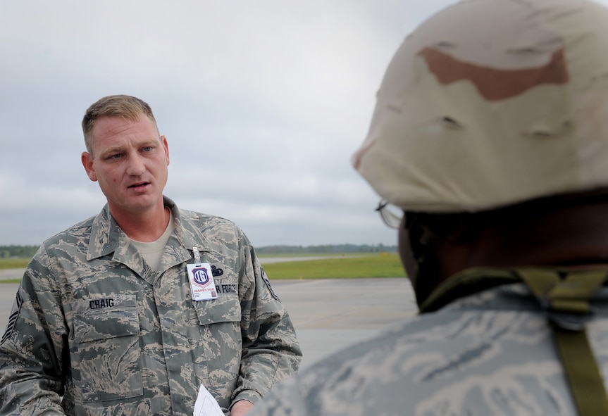 MOODY AIR FORCE BASE, Ga. -- Senior Master Sgt. Robert Craig Jr., Air Combat Commander Inspector General team member, speaks with a 23rd Logistic Readiness Squadron Airman during the Phase I Operational Readiness Inspection here Sept. 22. During the inspection, the 23rd Wing is tested on its capabilities to rapidly deploy personnel, equipment and assets. (U.S. Air Force photo by Senior Airman Gina Chiaverotti-Paige)