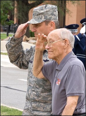 Col. Chris Nowland, left, 71st Flying Training Wing commander, and Fran Hoad, an Enid resident and World War II prisoner of war, salute during the playing of taps at the POW/MIA Recognition Day retreat ceremony at Vance AFB, Okla., Sept. 18. Mr. Hoad was on his 13th bombing run during World War II when he was shot down, captured and held in a German prison camp, Stalag Luft 2, for 13 months. (U.S. Air Force photo/ Terry Wasson)