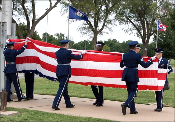 The Silver Talon Honor Guard lowers and folds the base ceremonial flag during the POW/MIA Recognition Day retreat ceremony at Vance AFB, Okla., Sept. 18. (U.S. Air Force photo/ Terry Wasson)