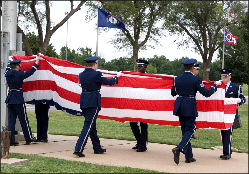 The Silver Talon Honor Guard lowers and folds the base ceremonial flag during the POW/MIA Recognition Day retreat ceremony at Vance AFB, Okla., Sept. 18. (U.S. Air Force photo/ Terry Wasson)