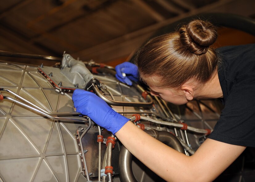 Airman Katherine Bouldin, 4th Component Maintenance Squadron aerospace propulsion apprentice, inspects an engine to clear a five-level write up on Seymour Johnson Air Force Base, N.C., Sept. 14, 2009. A five-level write up is a report of all discrepancies on an engine after an inspection is complete. (U.S. Air Force photo by Senior Airman Ciara Wymbs)
