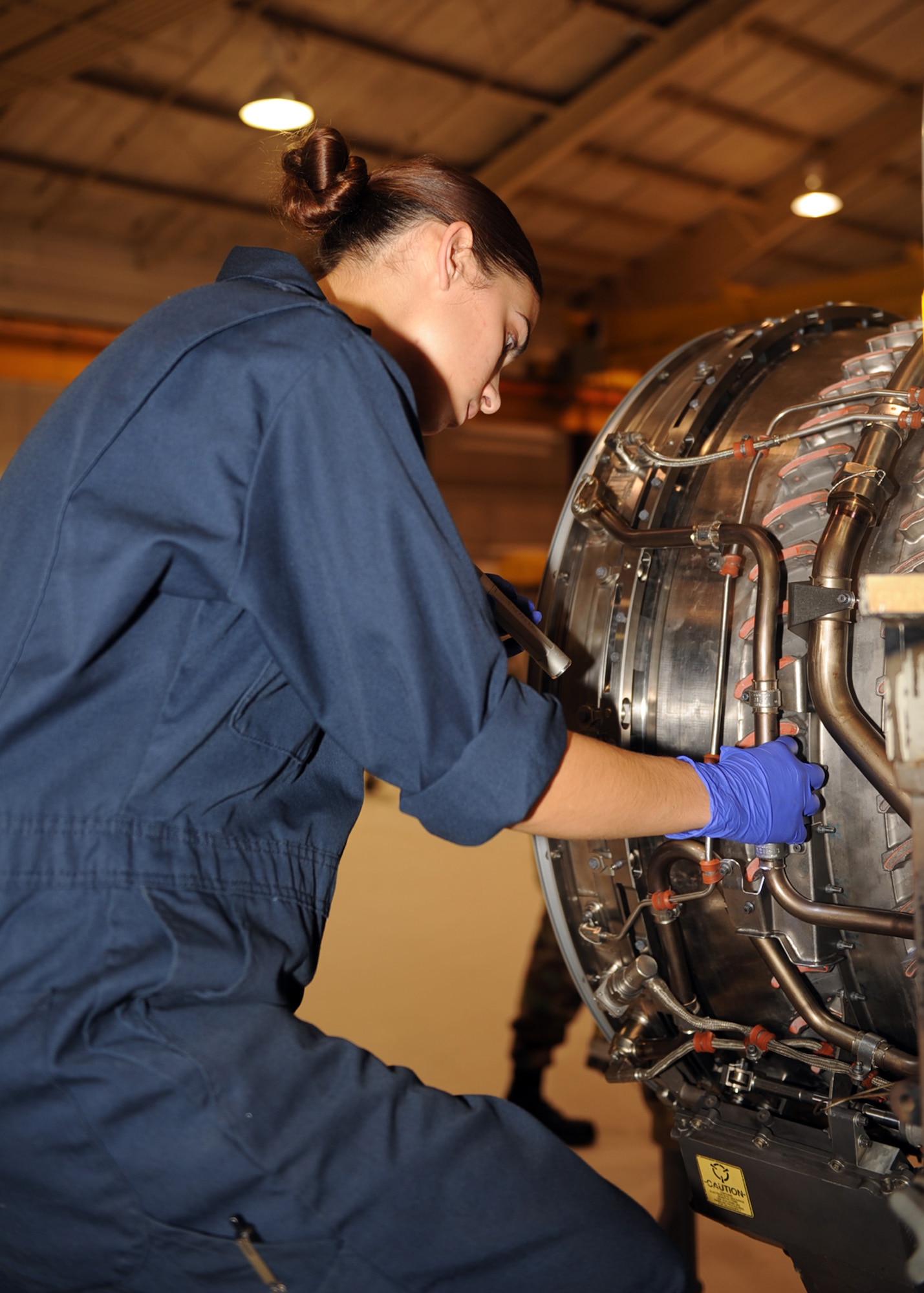 Airman 1st Class Laurel Smith, 4th Component Maintenance Squadron aerospace propulsion apprentice, performs an inspection on an engine to clear a five-level write up on Seymour Johnson Air Force Base, N.C., Sept. 14, 2009. The 4th Component Maintenance Squadron produces more than 130 engines per year and maintains more than 250 between Seymour Johnson and Langley Air Force bases. (U.S. Air Force photo by Senior Airman Ciara Wymbs)