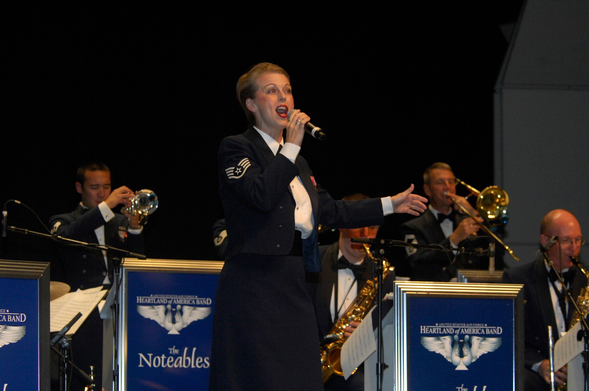 MINOT, N.D. -- Staff Sgt. Krista Joyce, Heartland of America Air Force Band Noteables vocalist, sings during a concert at Minot State University Sept. 17 here. This sleek, vibrant jazz ensemble presents exciting, uplifting music inspiring audiences to increased patriotism. (U.S. Air Force Photo by Airman 1st Class Jesse Lopez)