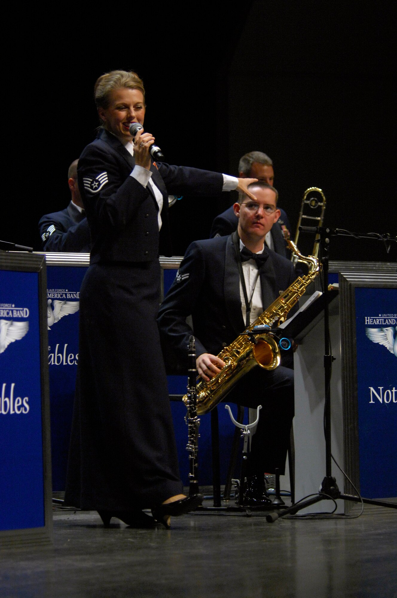 MINOT, N.D. -- Staff Sgt. Krista Joyce, Heartland of America Air Force Band Noteables vocalist, sings during a concert at Minot State University Sept. 17 here. This sleek, vibrant jazz ensemble presents exciting, uplifting music inspiring audiences to increased patriotism. (U.S. Air Force Photo by Airman 1st Class Jesse Lopez)