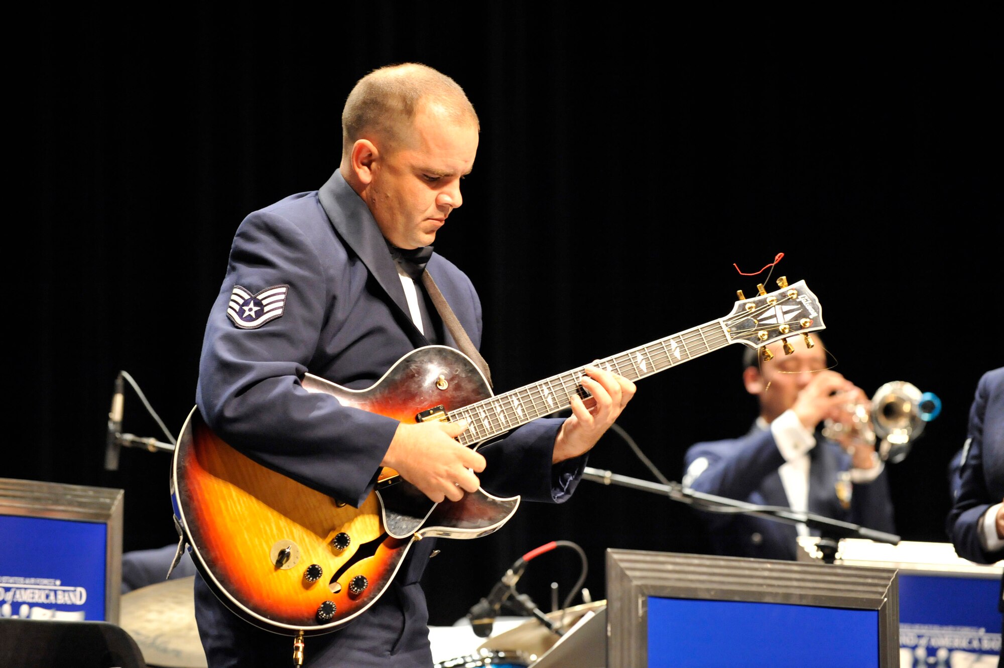 MINOT, N.D. -- Staff Sgt. Ryan Manzi, Heartland of America Air Force Band Noteables guitarist, plays his instrument during a concert at Minot State University Sept. 17 here. This sleek, vibrant jazz ensemble presents exciting, uplifting music inspiring audiences to increased patriotism. (U.S. Air Force Photo by Senior Airman Matthew Smith)