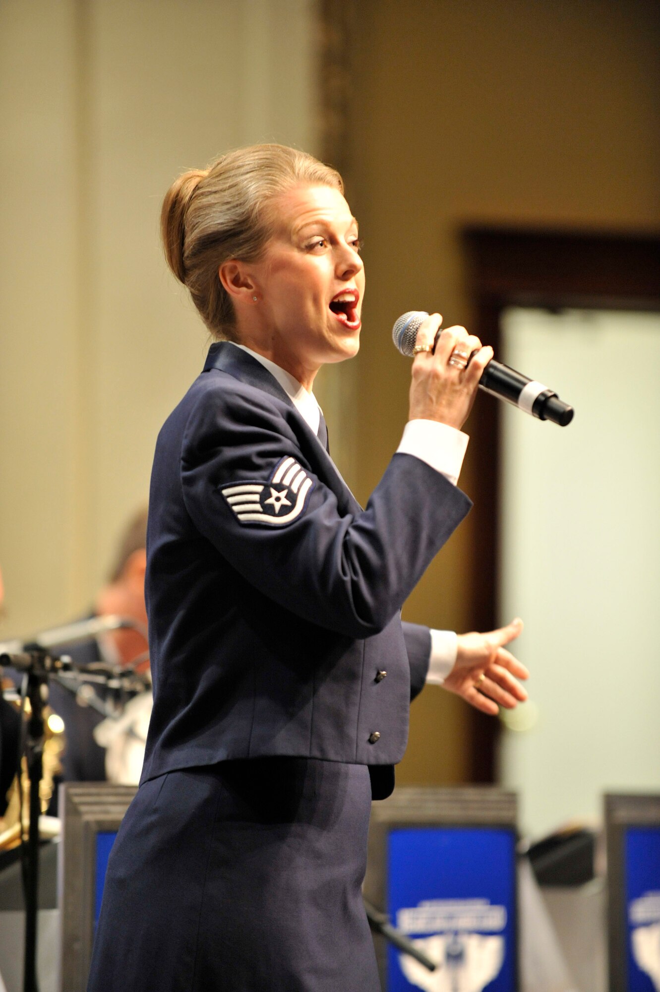 MINOT, N.D. -- Staff Sgt. Krista Joyce, Heartland of America Air Force Band Noteables vocalist, sings during a concert at Minot State University Sept. 17 here. This sleek, vibrant jazz ensemble presents exciting, uplifting music inspiring audiences to increased patriotism. (U.S. Air Force Photo by Senior Airman Matthew Smith)