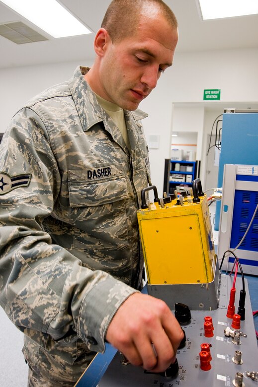 Airman 1st Class Eric Dasher, 62nd MXS, uses a stray voltage detector to test a
unit used to monitor electronic signals to the electronic countermeasure systems
in the C-17 Globemaster III. (U.S. Air Force photo/Abner Guzman)