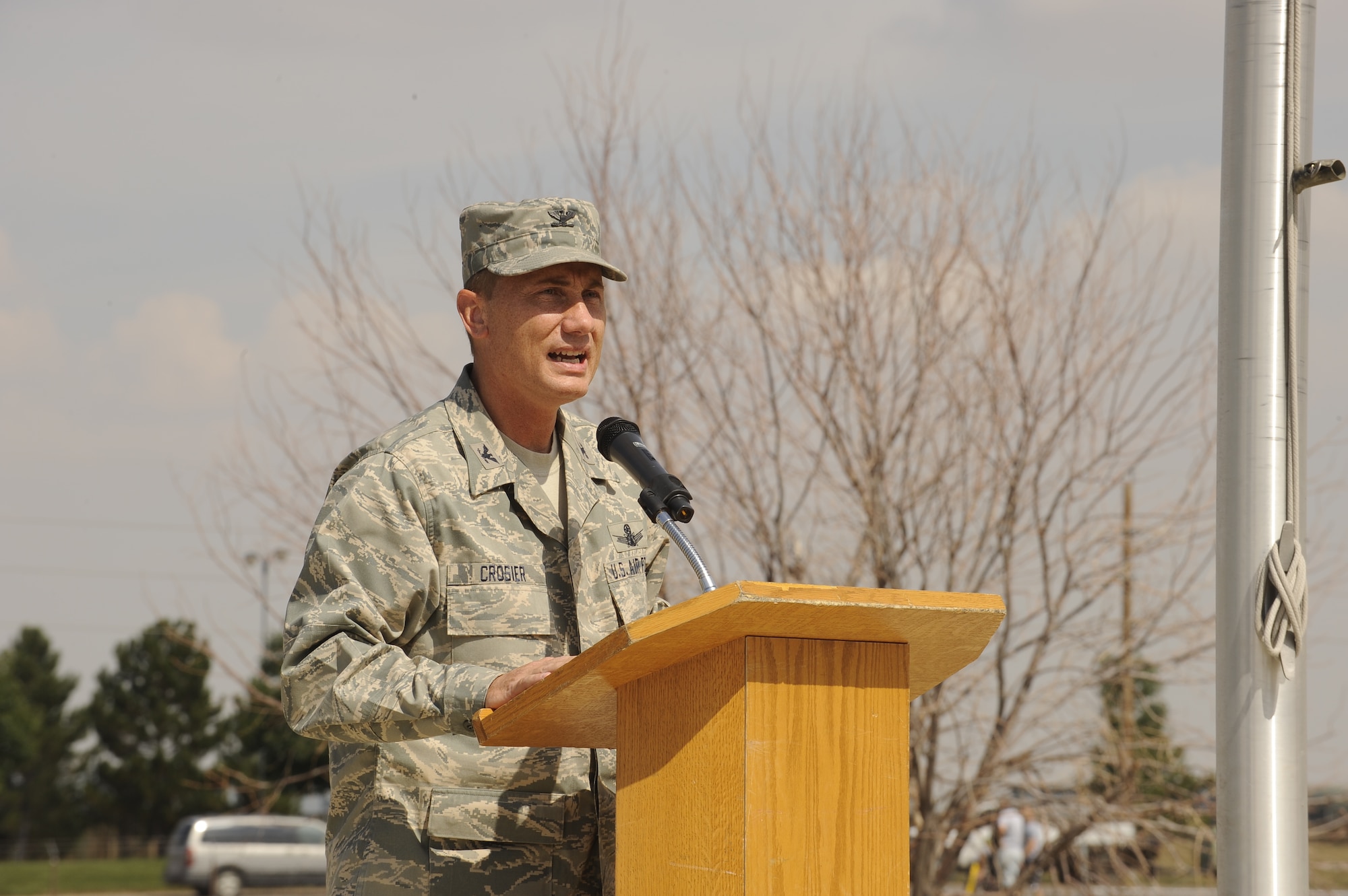 Colonel Clint Crosier, 460th Space Wing commander, addresses members of Team Buckley during the POW/MIA torch run held at the base track, Sept. 17. (U.S. Air Force photo by Senior Airman Steven Czyz)