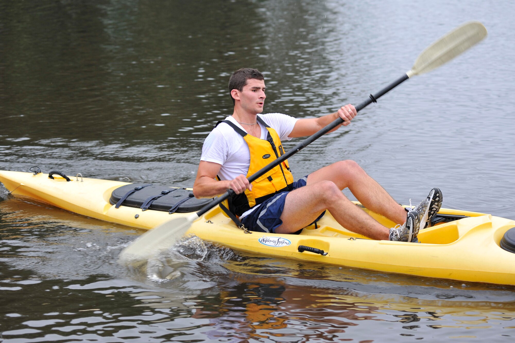 David Starcher (left), son of Master Sgt. Roger Starcher, 19th Equipment Maintenance Squadron, cruise to the finish line during the base Eco Challenge Sept. 19. The Eco Challenge consisted of a 4.7-mile run and a 1.5-mile kayak race. The biking portion of the challenge was cancelled due to poor weather conditions. (U.S. Air Force photo by Airman 1st Class Lausanne Pacheco)