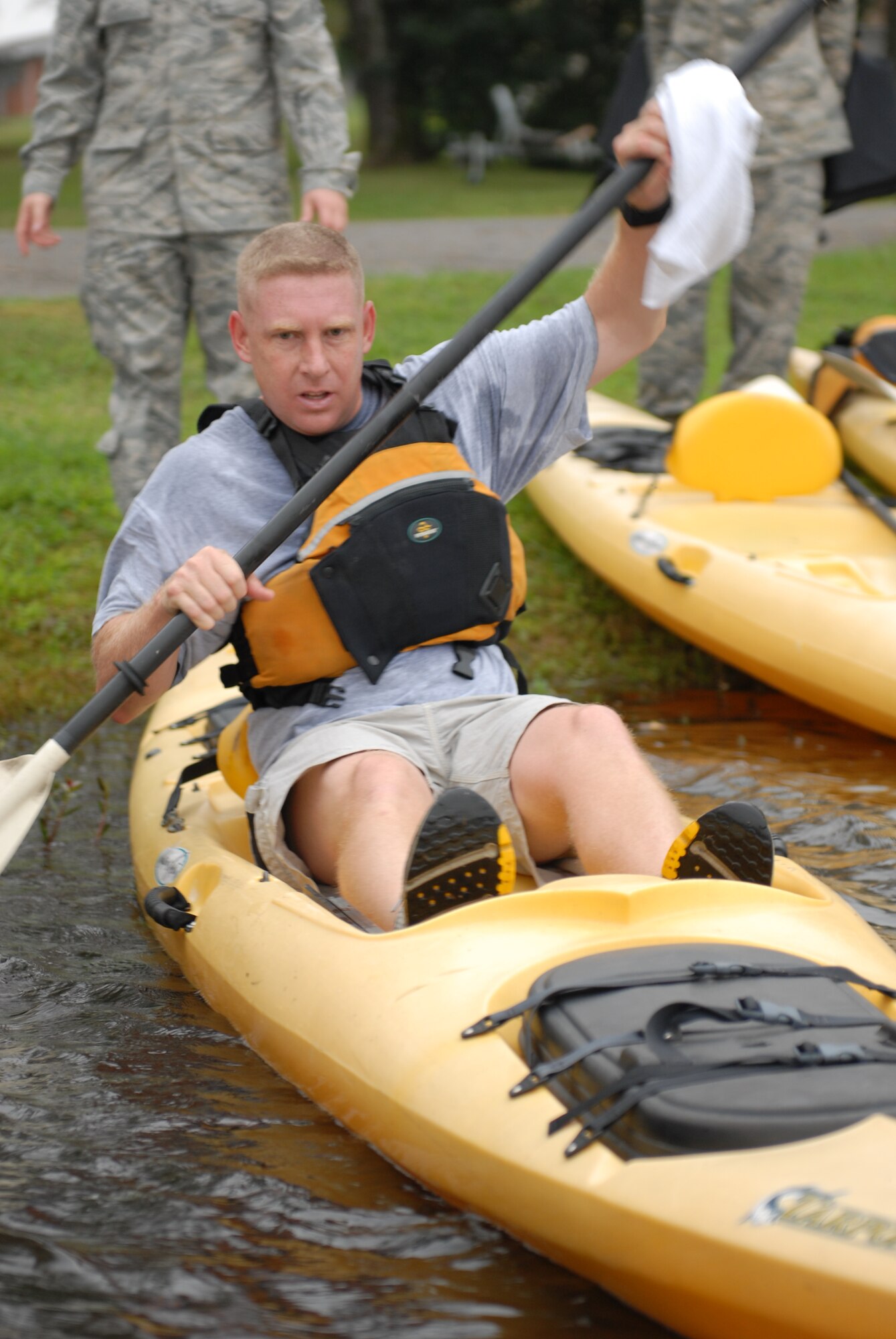 Senior Master Sgt. Todd Piazza, 19th Component Maintenance Squadron, shoves off from the shore during the kayaking portion of the base Eco Challenge Sept. 19. The Eco Challenge consisted of a 4.7-mile run and a 1.5-mile kayak race. The biking portion of the challenge was cancelled due to poor weather conditions. (U.S. Air Force photo by Staff Sgt. Nestor Cruz)