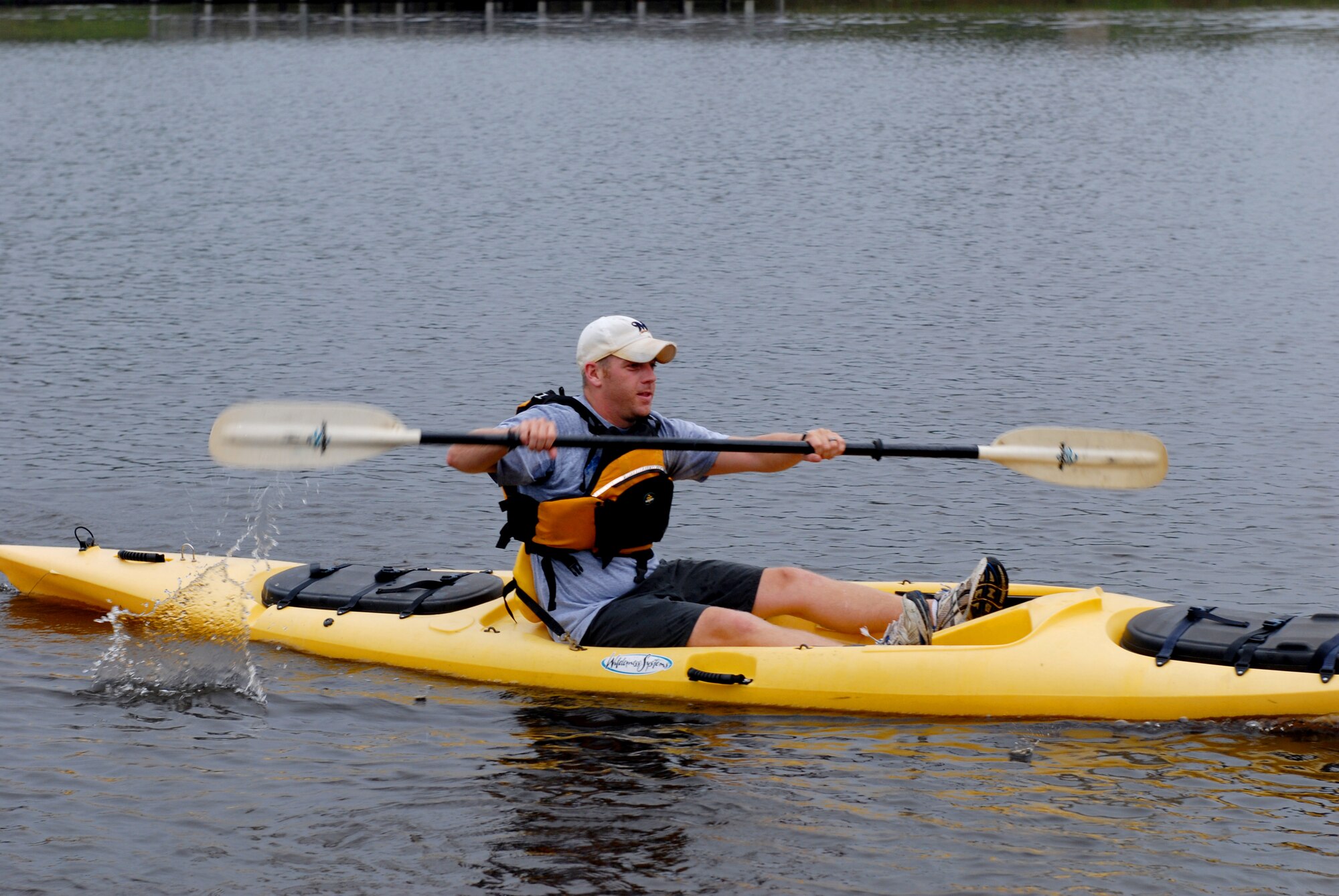 Brad Field, husband of 2nd Lt. Joeli Field, 34th Combat Training Squadron, slices through the water in a kayak while participating in the base Eco Challenge Sept. 19. The Eco Challenge consisted of a 4.7-mile run and a 1.5-mile kayak race. The biking portion of the challenge was cancelled due to poor weather conditions. (U.S. Air Force photo by Senior Airman Nathan Allen)