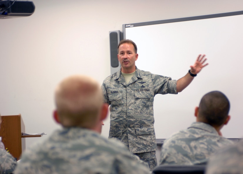 MINOT AIR FORCE BASE N.D. -- Chief Master Sgt. Gregory Flemming, 91st Missile Wing command chief, speaks to young Airmen about the importance of the whole Airmen concept at one of the classes offered during wingman day Sept. 18. The 5th Bomb Wing event, which coincided with the Air Force’s 62nd birthday, was held as a means to strengthen the morale and welfare of each unit by empowering and encouraging Airmen to not only become great wingmen, but future leaders. (U.S. Air Force photo by Airman 1st Class Aaron-Forrest Wainwright)