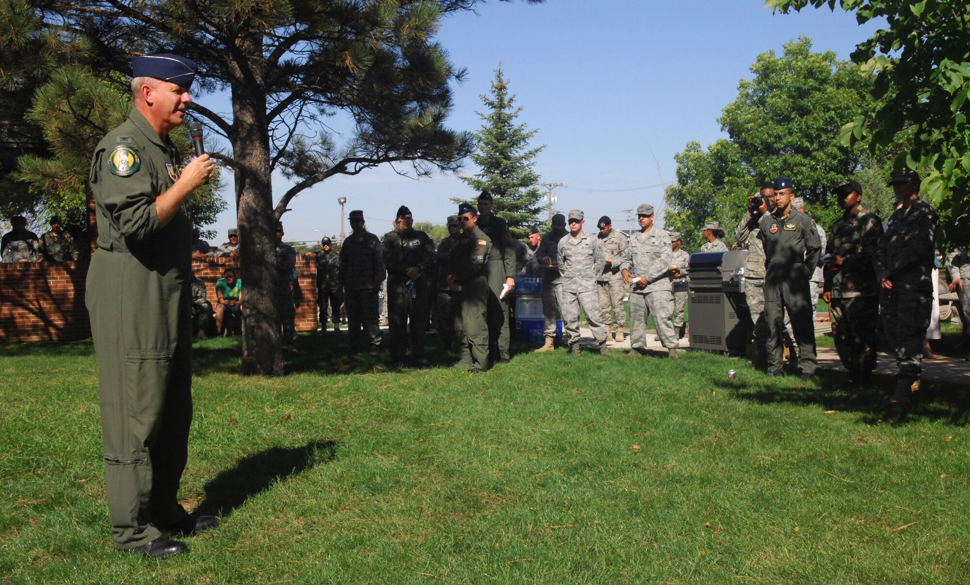 MINOT AIR FORCE BASE, N.D. -- Col. Joel Westa, 5th Bomb Wing commander, gives some remarks during a burger burn at the Northern Lights Chapel here as part of wingman day Sept. 18. The 5th Bomb Wing event, which coincided with the Air Force’s 62nd birthday, was held as a means to strengthen the morale and welfare of each unit by empowering and encouraging Airmen to not only become great wingmen, but future leaders. (U.S. Air Force photo by Senior Airman Wesley Wright)