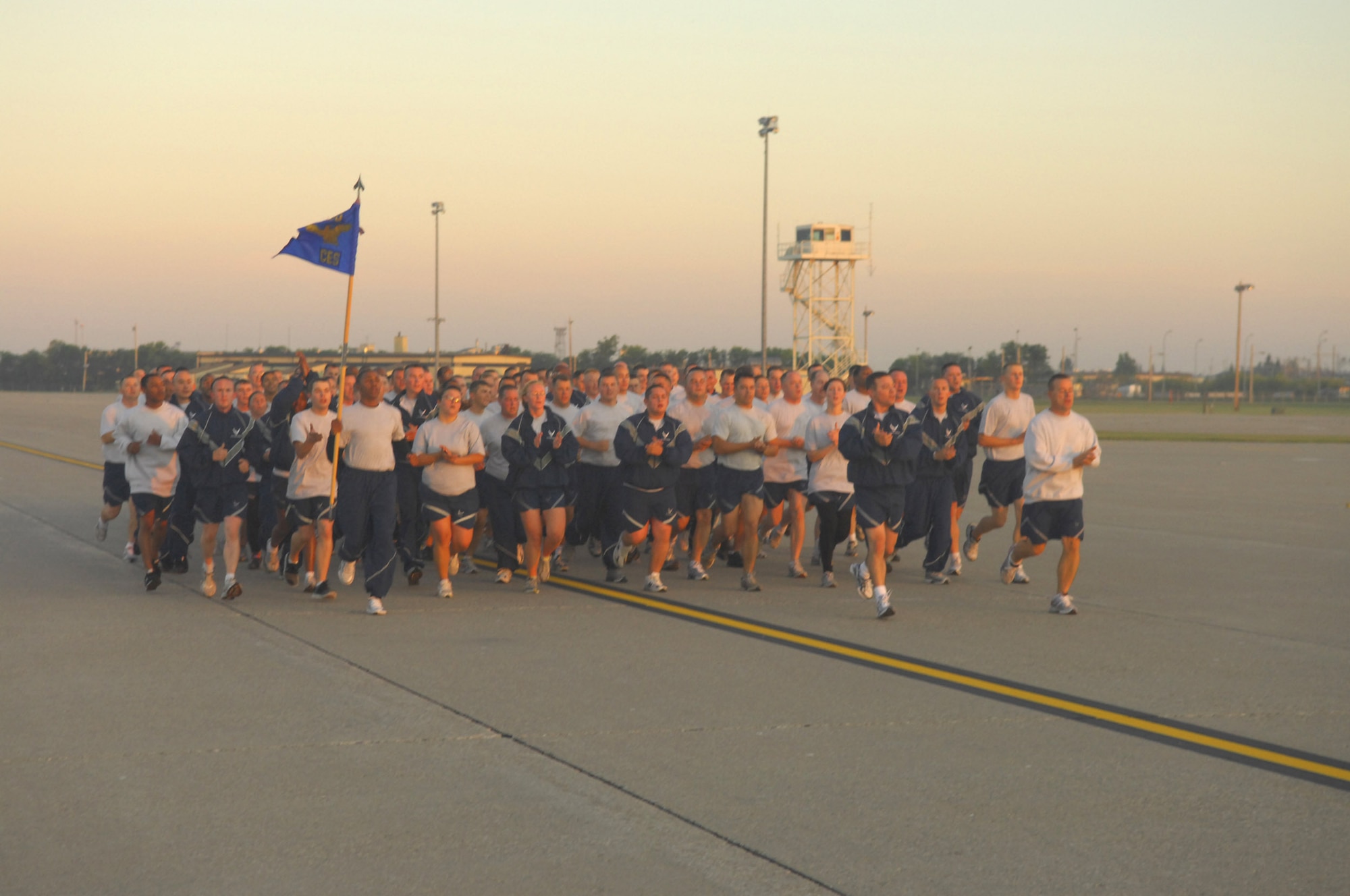MINOT AIR FORCE BASE, N.D. -- The 5th Civil Engineer Squadron closes in on the finish line during a group flightline run as part of wingman day here Sept. 18. The 5th Bomb Wing event, which coincided with the Air Force’s 62nd birthday, was held as a means to strengthen  the morale and welfare of each unit by empowering and encouraging Airmen to not only become great wingmen, but future leaders. (U.S. Air Force photo by Senior Airman Wesley Wright)